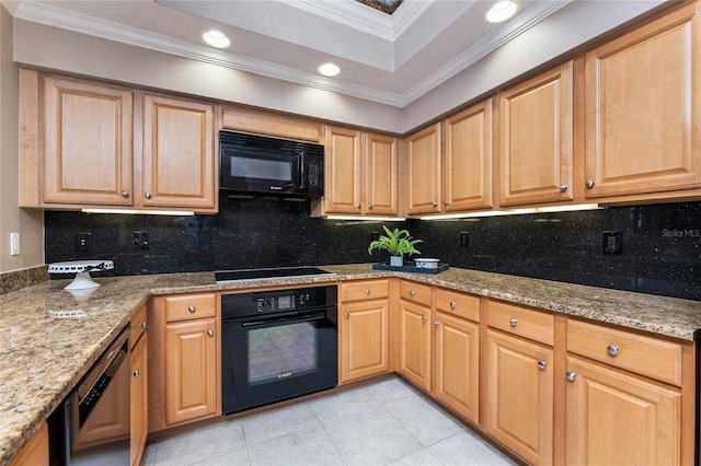 kitchen with backsplash, light tile patterned flooring, black appliances, and light stone countertops