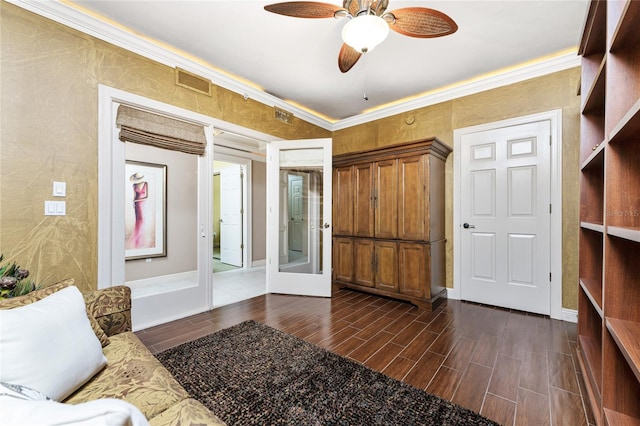 interior space featuring ceiling fan, french doors, and crown molding