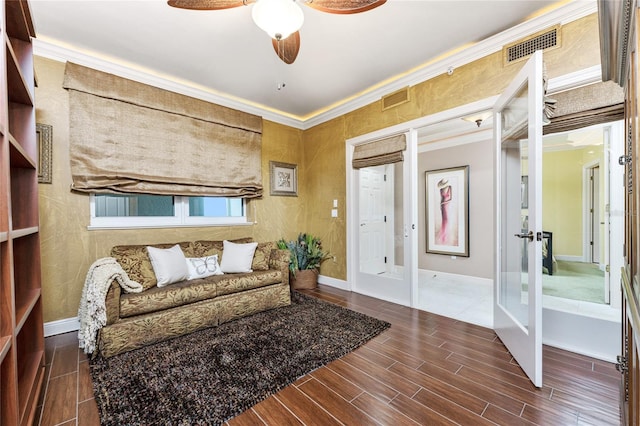 living area with ornamental molding, ceiling fan, and french doors