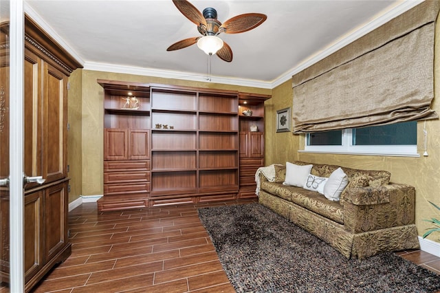 living room featuring ceiling fan and ornamental molding