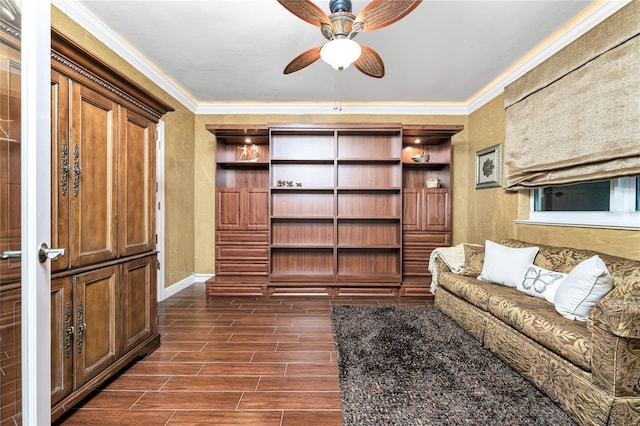 living room featuring ceiling fan and ornamental molding