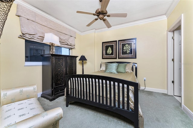 carpeted bedroom featuring ceiling fan and ornamental molding