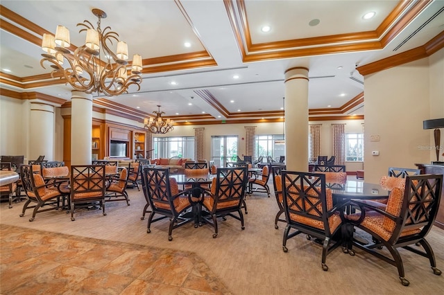 dining area featuring a notable chandelier, crown molding, and decorative columns