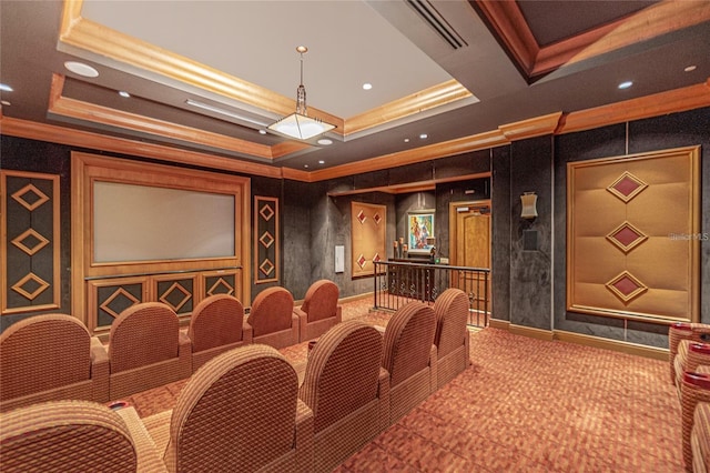 cinema featuring ornamental molding and a tray ceiling