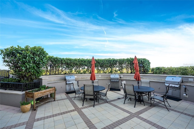 view of patio featuring exterior kitchen and area for grilling