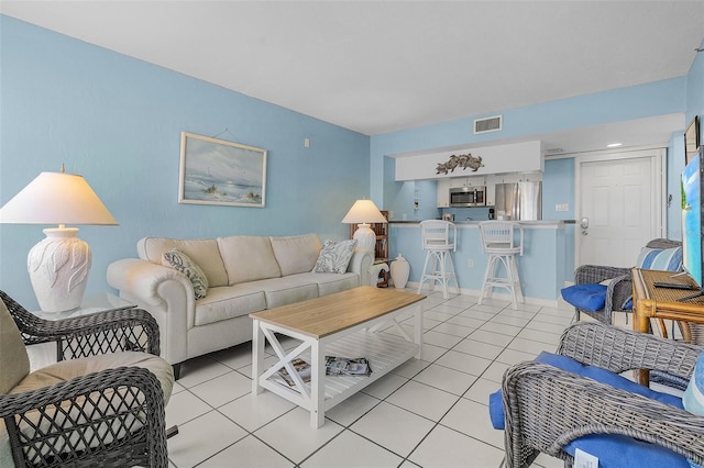 living room featuring light tile patterned flooring