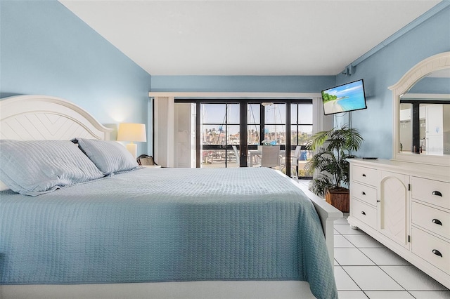 bedroom with access to exterior and light tile patterned floors