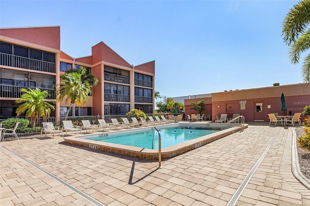 view of swimming pool with a patio