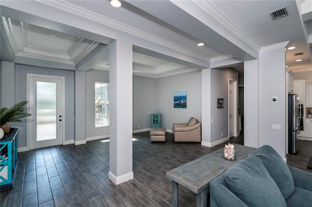 living room featuring dark hardwood / wood-style floors, crown molding, and a tray ceiling