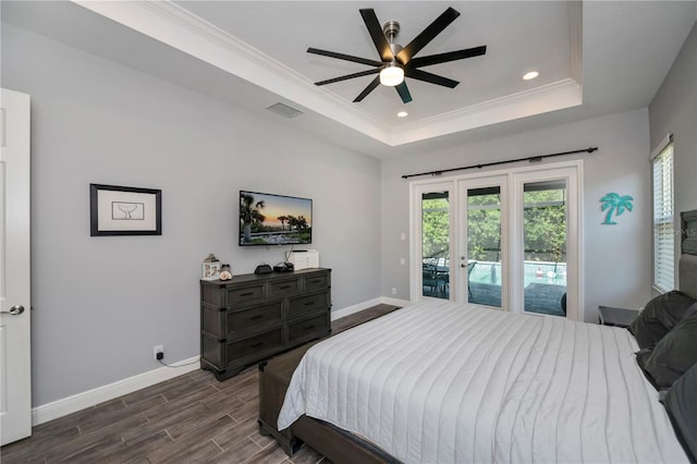 bedroom featuring access to outside, crown molding, a raised ceiling, dark hardwood / wood-style flooring, and ceiling fan