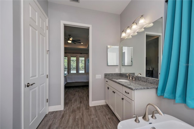 bathroom with vanity, hardwood / wood-style floors, and ceiling fan