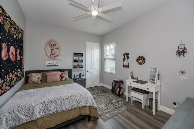 bedroom with dark wood-type flooring and ceiling fan