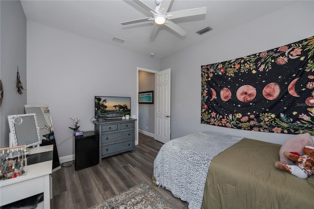 bedroom with ceiling fan and dark hardwood / wood-style flooring