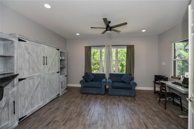 interior space featuring ceiling fan and dark hardwood / wood-style floors