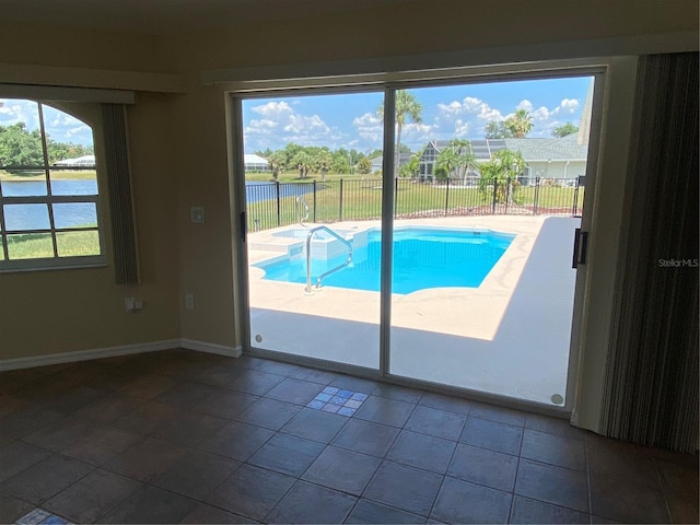 view of pool featuring a water view