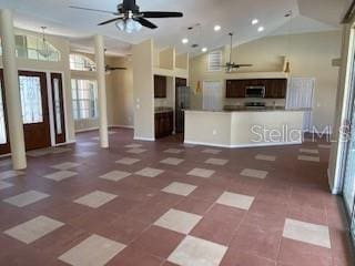 kitchen featuring a kitchen island, vaulted ceiling, and ceiling fan