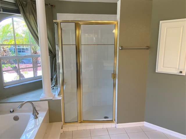 bathroom featuring ornate columns, a wealth of natural light, tile patterned floors, and separate shower and tub