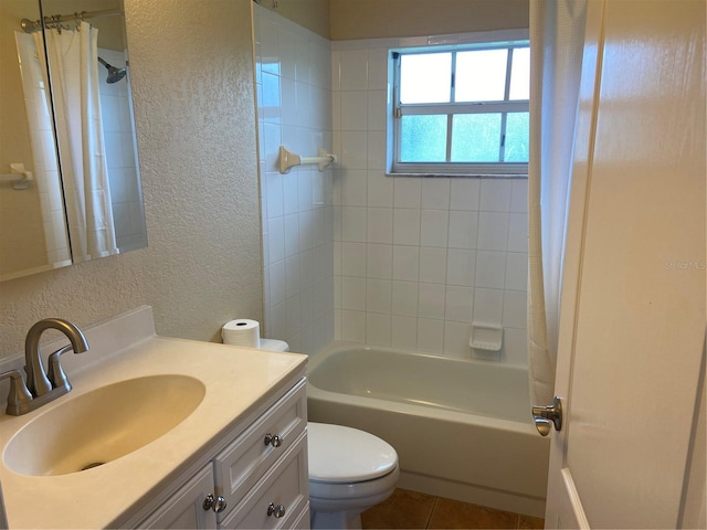 full bathroom with shower / bath combo, toilet, tile patterned floors, and vanity