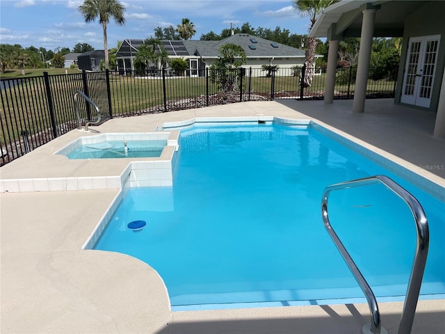 view of pool featuring an in ground hot tub and a patio