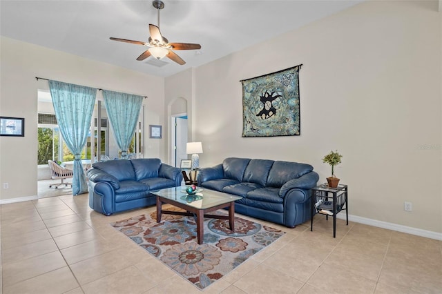 tiled living room featuring ceiling fan