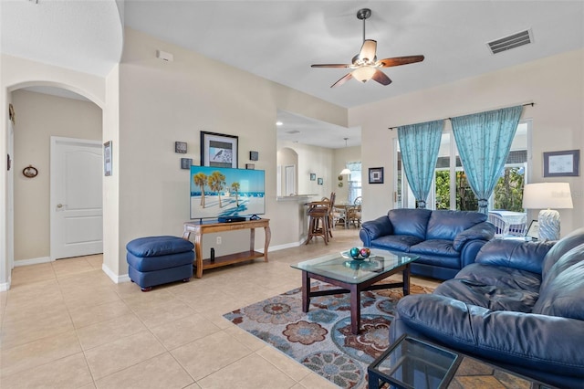 living room with ceiling fan and light tile patterned floors