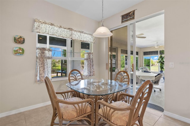 tiled dining area featuring ceiling fan