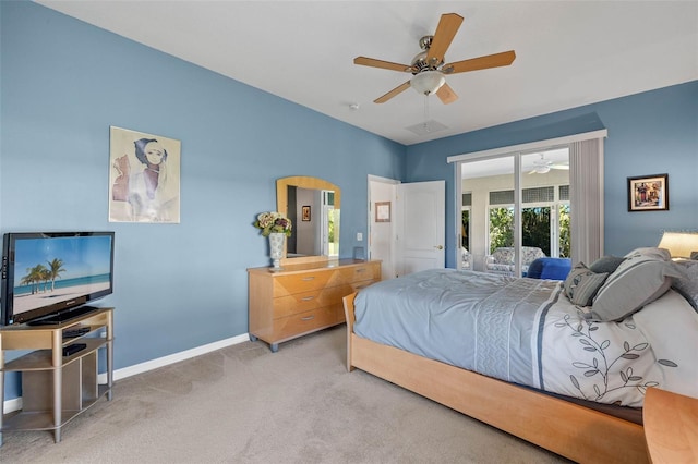 carpeted bedroom featuring access to exterior and ceiling fan