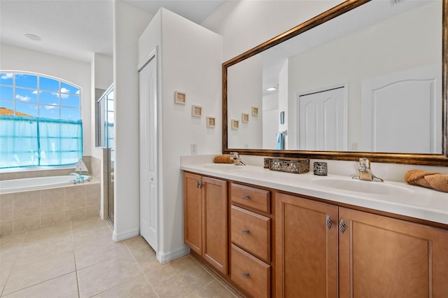 bathroom featuring vanity, tile patterned floors, and separate shower and tub