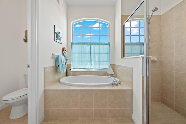 bathroom with separate shower and tub, tile patterned flooring, and toilet