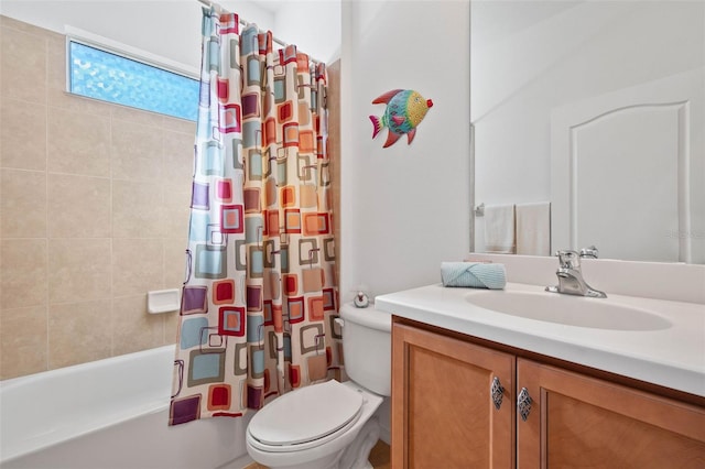 full bathroom with vanity, toilet, and shower / bath combo with shower curtain