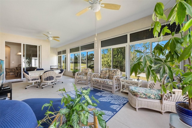 sunroom / solarium featuring ceiling fan