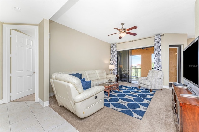 living room with ceiling fan and light tile patterned floors