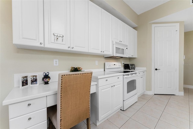 kitchen with white cabinets, white appliances, and light tile patterned floors