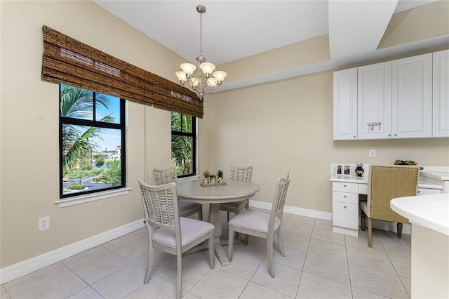 dining space featuring light tile patterned flooring and an inviting chandelier