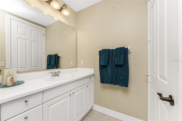 bathroom featuring tile patterned flooring and vanity