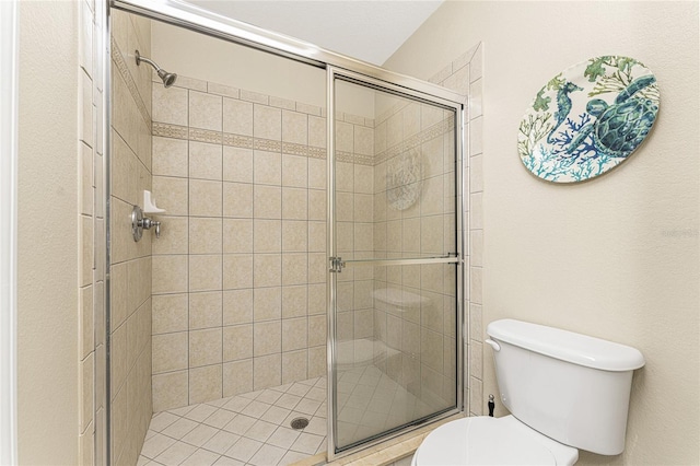 bathroom with walk in shower and toilet