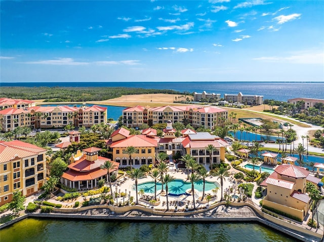 birds eye view of property featuring a water view