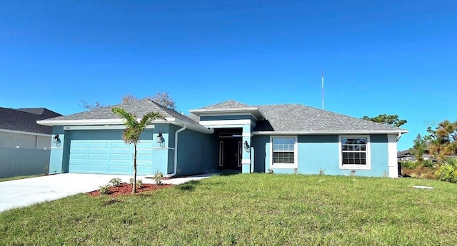 view of front facade with a garage and a front lawn