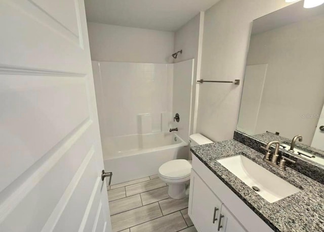 full bathroom featuring vanity,  shower combination, and toilet