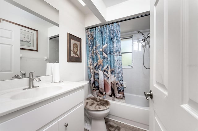 full bathroom with shower / bathtub combination with curtain, vanity, and toilet