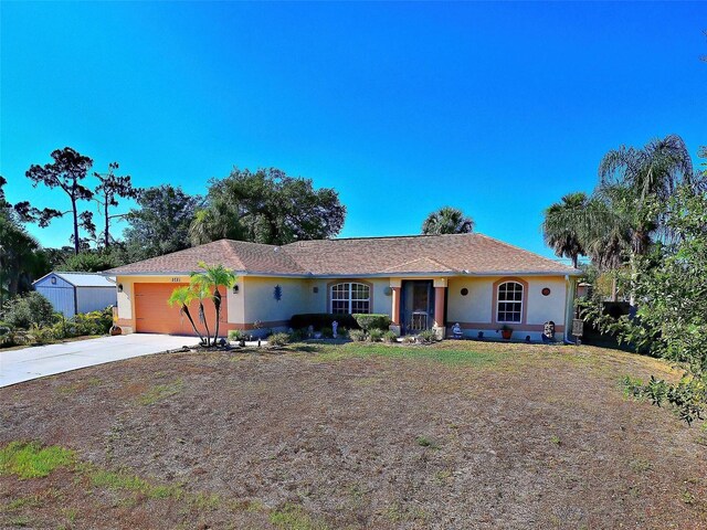 single story home featuring a garage