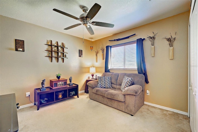 living room featuring carpet and ceiling fan