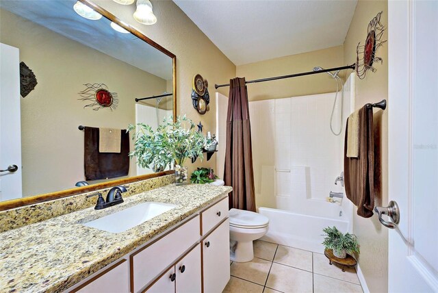 full bathroom with tile patterned flooring, shower / bath combination with curtain, toilet, and vanity