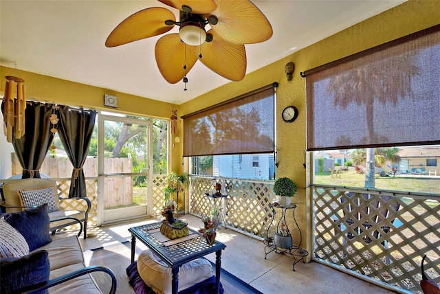 sunroom featuring ceiling fan