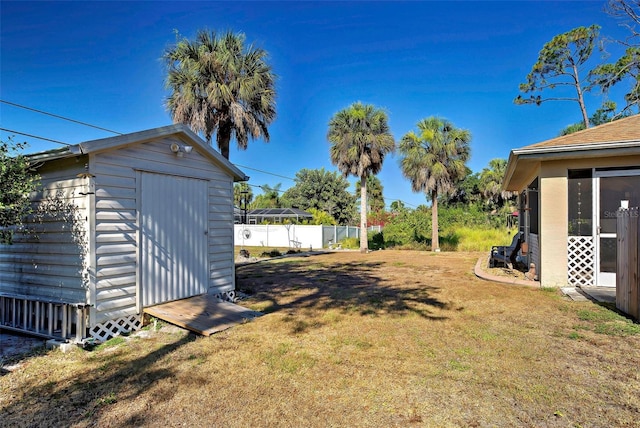 view of yard with a storage unit