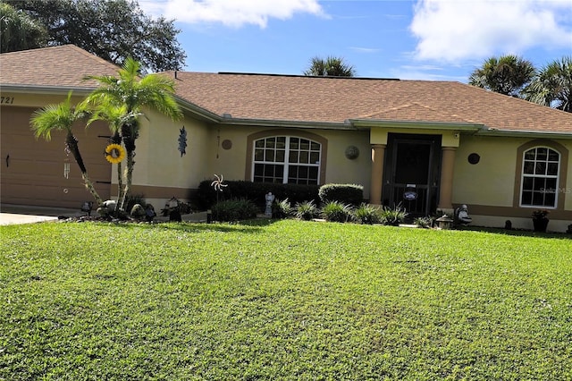 single story home featuring a garage, a front yard, roof with shingles, and stucco siding