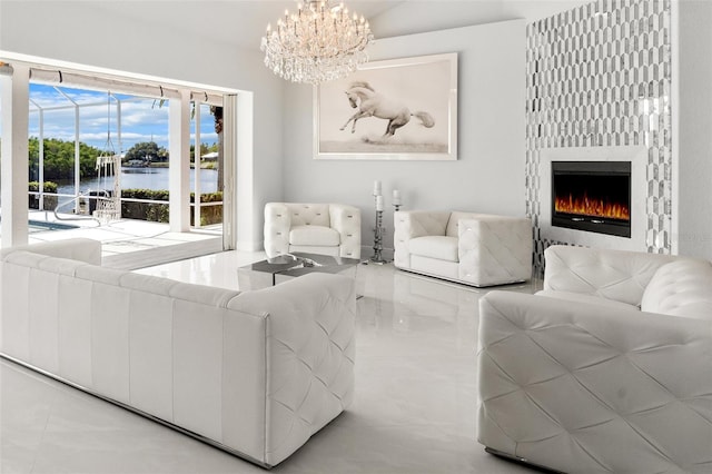 living room featuring a notable chandelier, a water view, and light tile floors