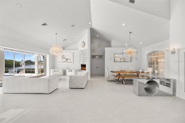 tiled living room featuring a notable chandelier, a water view, high vaulted ceiling, and a fireplace