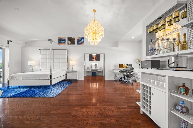 bedroom featuring an inviting chandelier and hardwood / wood-style floors