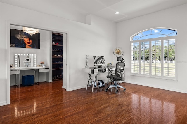 office featuring built in desk and dark wood-type flooring